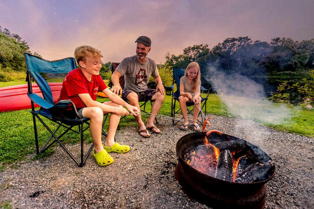 Family time around the campfire in Maine's Kennebec Valley.