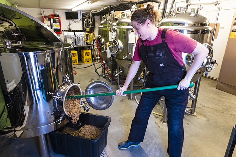 Brewer at work in the brew room of Grateful Grains, Monmouth, Maine